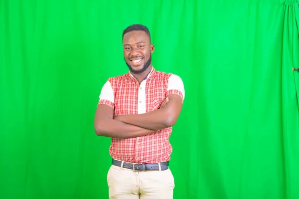 Portrait Handsome Young Man Standing Green Background Crossing His Arms — Stock Photo, Image