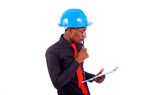 Young Man Engineer Wearing Blue Safety Helmet Reading Document Note — Stock Photo, Image