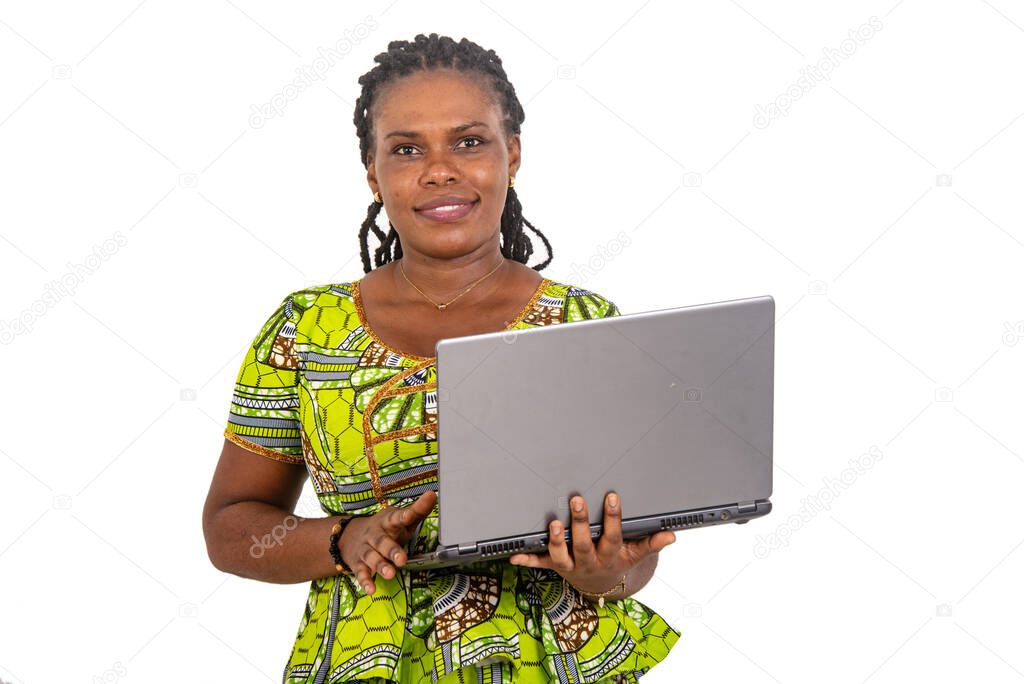 beautiful young businesswoman holding laptop computer while smiling.