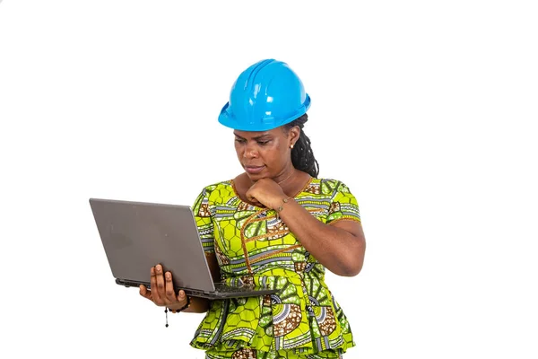 Beautiful Young Female Engineer Wearing Safety Helmet Working Laptop While — Fotografia de Stock