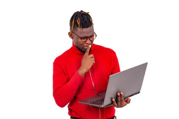 Young Man Wearing Red Sweater Using Laptop Thinking Something Must — Stock Photo, Image