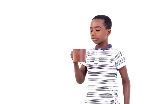 Young Boy Shirt Standing White Background Looking Cup — Stock Photo, Image