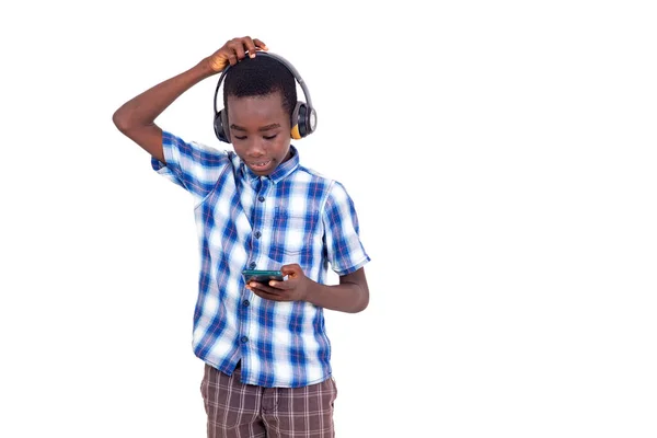 Young Boy Checkered Shirt Standing White Background Listening Music While — Stock Photo, Image