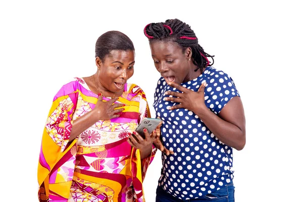 Two Surprised Women Use Mobile Apps Online Shopping Standing White — Stock Photo, Image