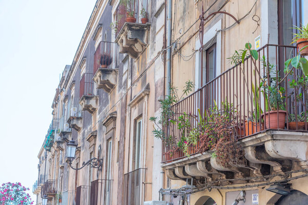 Facades of traditional houses in the Sicilian town Catania, Italy.