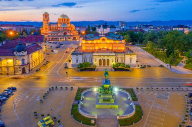 Night view of the National Assembly of the Republic of Bulgaria and Alexander Nevski cathedral in Sofia. Sign translates - Unity makes power clipart