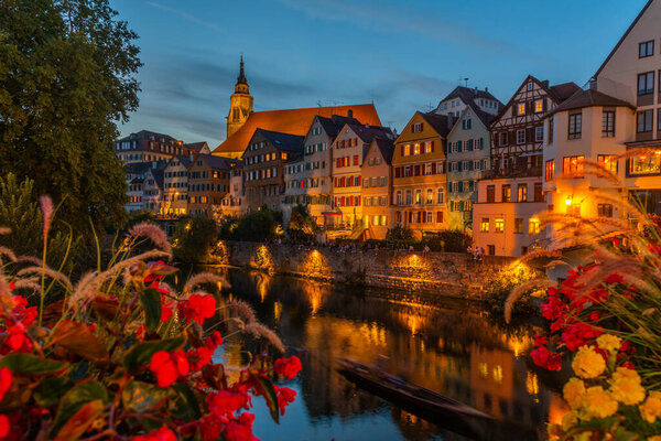 Sunset view of colorful facades of houses alongside river Neckar in Tubingen, Germany