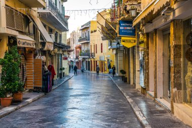 ATHENS, GREECE, DECEMBER 10, 2015: View of Adrianu shopping street - the most important tourist street in the historical district of athens called plaka