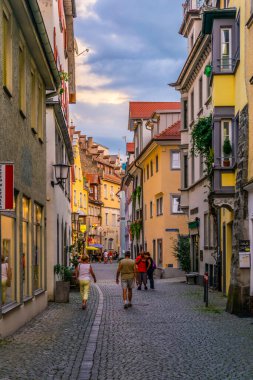 LINDAU, GERMANY, JULY 24, 2016: People are strolling through a street in lindau, Germany