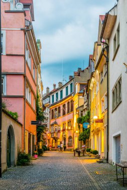 LINDAU, GERMANY, JULY 24, 2016: People are strolling through a narrow street in lindau, Germany