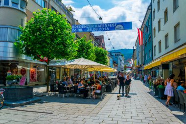 BREGENZ, AUSTRIA, JULY 25, 2016: People are strolling through a pedestrian street near chapel of saint john of Nepomuk in Bregenz, Austria