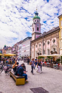 INNSBRUCK, AUSTRIA, JULY 27, 2017: People are passing through the town square dominated by Anna s column in Innsbruck, Austria.