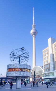 BERLIN, GERMANY, MARCH 12, 2015: detail of the world clock in berlin with famous fernsehturm behind it.