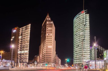 BERLIN, GERMANY, MARCH 12, 2015: potzdamer platz in berlin is newly building business center of the city and its highlight are three tall skyscrapers.