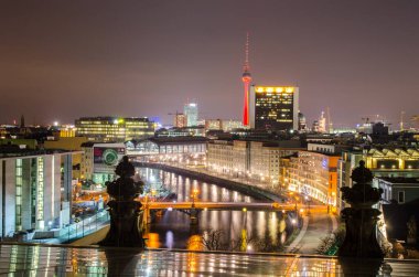 BERLIN, GERMANY, MARCH 12, 2015: night view of spree river and fernsehturm in berlin taken from the top of reichstag building.