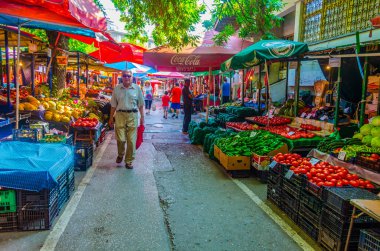 VELIKO TARNOVO, BULGARIA, AUGUST 10, 2014: People are strolling through a market in Veliko Tarnovo town in Bulgaria