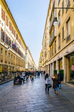TORINO, ITALY, MARCH 12, 2016: people are walking on a street in the italian city torino