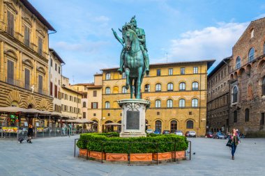 FLORENCE, ITALY, MARCH 15, 2016: Tourists admire Equestrian statue of Cosimo I de' Medici on the Piazza della Signoria on Piazza della Signoria in Florence