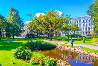 RIGA, LATVIA, AUGUST 15, 2016: People are walking through the Bastelkajna park in Riga, Latvia.