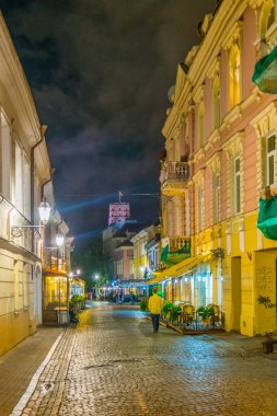VILNIUS, LITHUANIA, AUGUST 14, 2016: Night view of the Pilies gatve which is the main tourist street in Vilnius, Lithuania