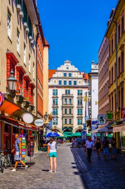 MUNICH, GERMANY, AUGUST 20, 2015: people are buying souvenirs on orlandostrasse in munich which hosts famous hofbrauhaus at ist end