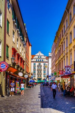 MUNICH, GERMANY, AUGUST 20, 2015: people are buying souvenirs on orlandostrasse in munich which hosts famous hofbrauhaus at ist end