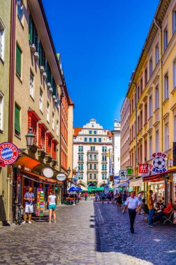 MUNICH, GERMANY, AUGUST 20, 2015: people are buying souvenirs on orlandostrasse in munich which hosts famous hofbrauhaus at ist end