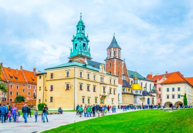 KRAKOW, POLAND, AUGUST 11, 2016: People are walking through grounds of the Wawel castle in Krakow/Cracow, Poland.