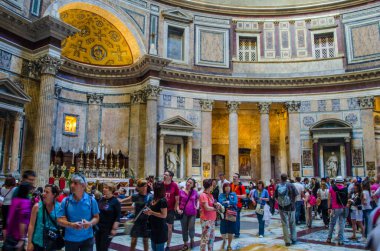 ROME, ITALY, JUNE 1, 2014: Tourists visit the Pantheon in Rome, Italy. Pantheon is a famous monument of ancient Roman culture, the temple of all the gods, built in the 2nd century.