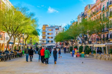 TARRAGONA, SPAIN, DECEMBER 29, 2015: Place de la font is one of the main squares of spanish city Tarragona which is popular place for drinking a cup of coffee or enjoying nightlife.
