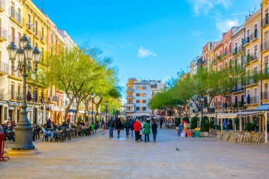 TARRAGONA, SPAIN, DECEMBER 29, 2015: Place de la font is one of the main squares of spanish city Tarragona which is popular place for drinking a cup of coffee or enjoying nightlife.