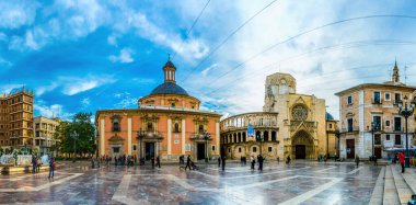 VALENCIA, SPAIN, DECEMBER 30, 2015: Square of Saint Mary's with Valencia Cathedral Temple, Basilica de la nuestra senora de los desamparados and the rio tura fountain in old town.