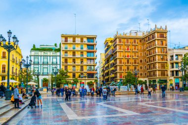VALENCIA, SPAIN, DECEMBER 30, 2015: Square of Saint Mary's with Valencia Cathedral Temple, Basilica de la nuestra senora de los desamparados and the rio tura fountain in old town.