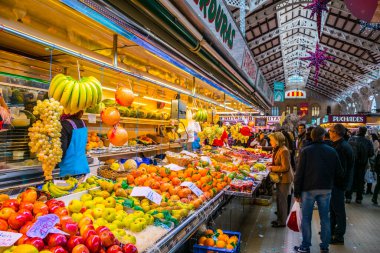 VALENCIA, SPAIN, DECEMBER 30, 2015: Customers are doing their groceries inside of the central market in valencia.