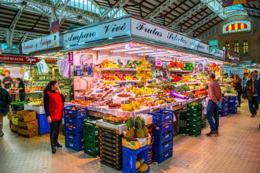 VALENCIA, SPAIN, DECEMBER 30, 2015: Customers are doing their groceries inside of the central market in valencia.