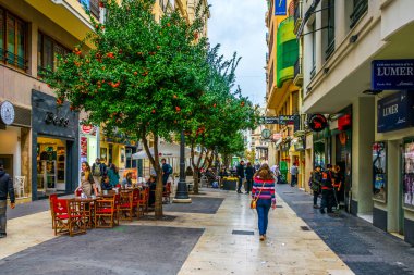 VALENCIA, SPAIN, DECEMBER 30, 2015: people are walking through carrer de ribera street situated in the historical centre of spanish city Valencia