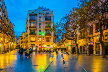 VALENCIA, SPAIN, DECEMBER 30, 2015: view of the carrer del mur de santa anna street situated in the historical centre of spanish city Valencia during sunset