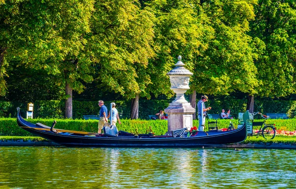 MUNICH, GERMANY, AUGUST 20, 2015: gondola ride in the nymphenburg palace gardens is one of many pleasant activities available to visitors