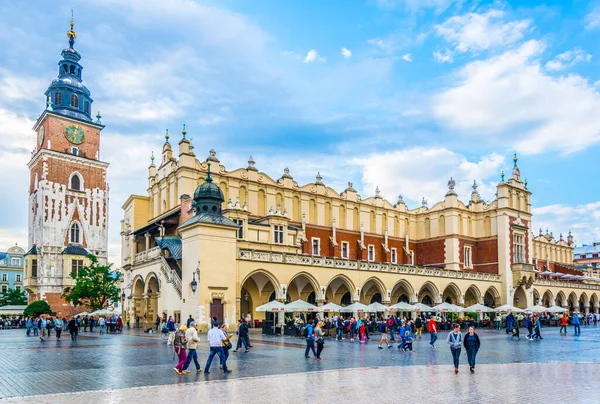 KRAKOW, POLAND, AUGUST 11, 2016: Panorama of the rynek glowny main square with the town hall and sukiennice marketplace in the polish city Cracow/Krakow.