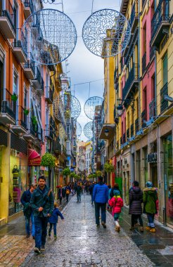 GRANADA, SPAIN, JANUARY 3, 2016: View of souvenir shops stretching alongside the way to the alhambra palace in spain.