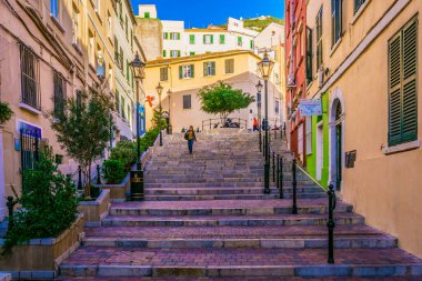 GIBRALTAR, GIBRALTAR, JANUARY 5, 2016: people are strolling through a narrow street of Gibraltar