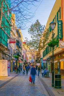 GIBRALTAR, GIBRALTAR, JANUARY 5, 2016: people are strolling through a narrow street of Gibraltar