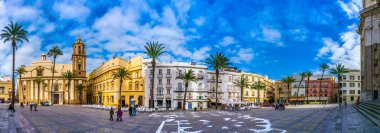 CADIZ, SPAIN, JANUARY 6, 2016: people are passing plaza de la catedral in front of the cathedral in cadiz