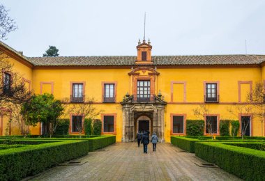 SEVILLA, SPAIN, JANUARY 7, 2016: people are walking over the main courtyard of the real alcazar palace in the spanish city sevilla