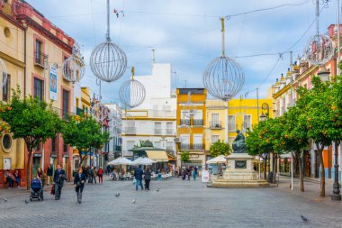 SEVILLA, SPAIN, JANUARY 7, 2016: people are strolling on the plaza del salvador in the spanish city sevilla