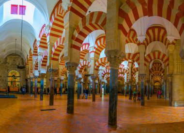 CORDOBA, SPAIN, JANUARY 8, 2016: Arches and Pillars of the la Mezquita cathedral in Cordoba, Spain. clipart