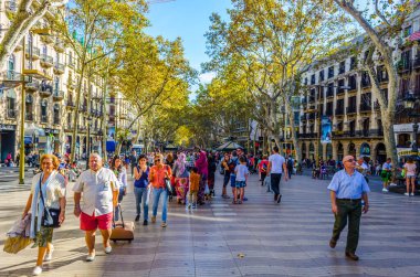 BARCELONA, SPAIN, OCTOBER 24,2014: People are strolling on the la rambla street in Barcelona.
