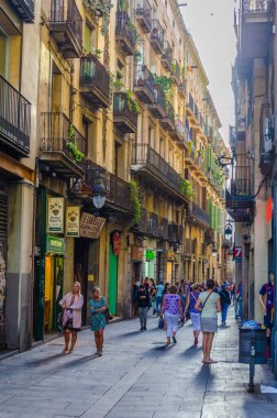 BARCELONA, SPAIN, OCTOBER 24,2014: View of a narrow street in the historical center of Barcelona, Spain.