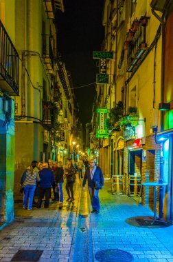 LOGRONO, SPAIN, OCTOBER 28,2014: People are strolling a street in Logrono during night