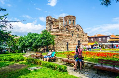 NESEBAR, BULGARIA, JULY 17, 2015: People are strolling around famous church in nesebar - The Christ Pantocrator - UNESCO World Heritage Site.